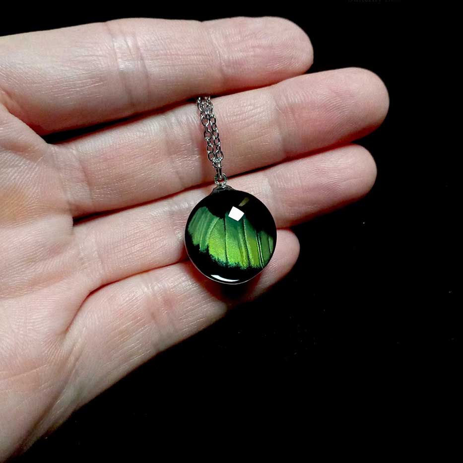 panacea prola butterfly wing necklace on hand
